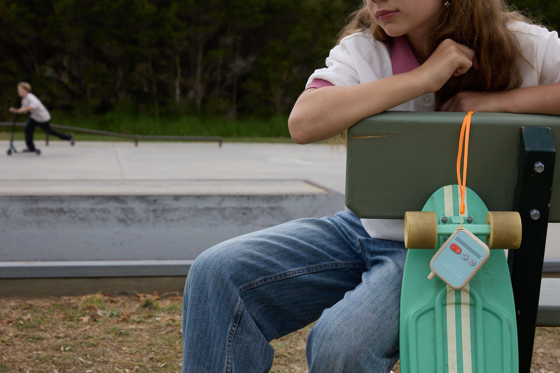 Kid at the skatepark with Chatterbox Go portable kids phone